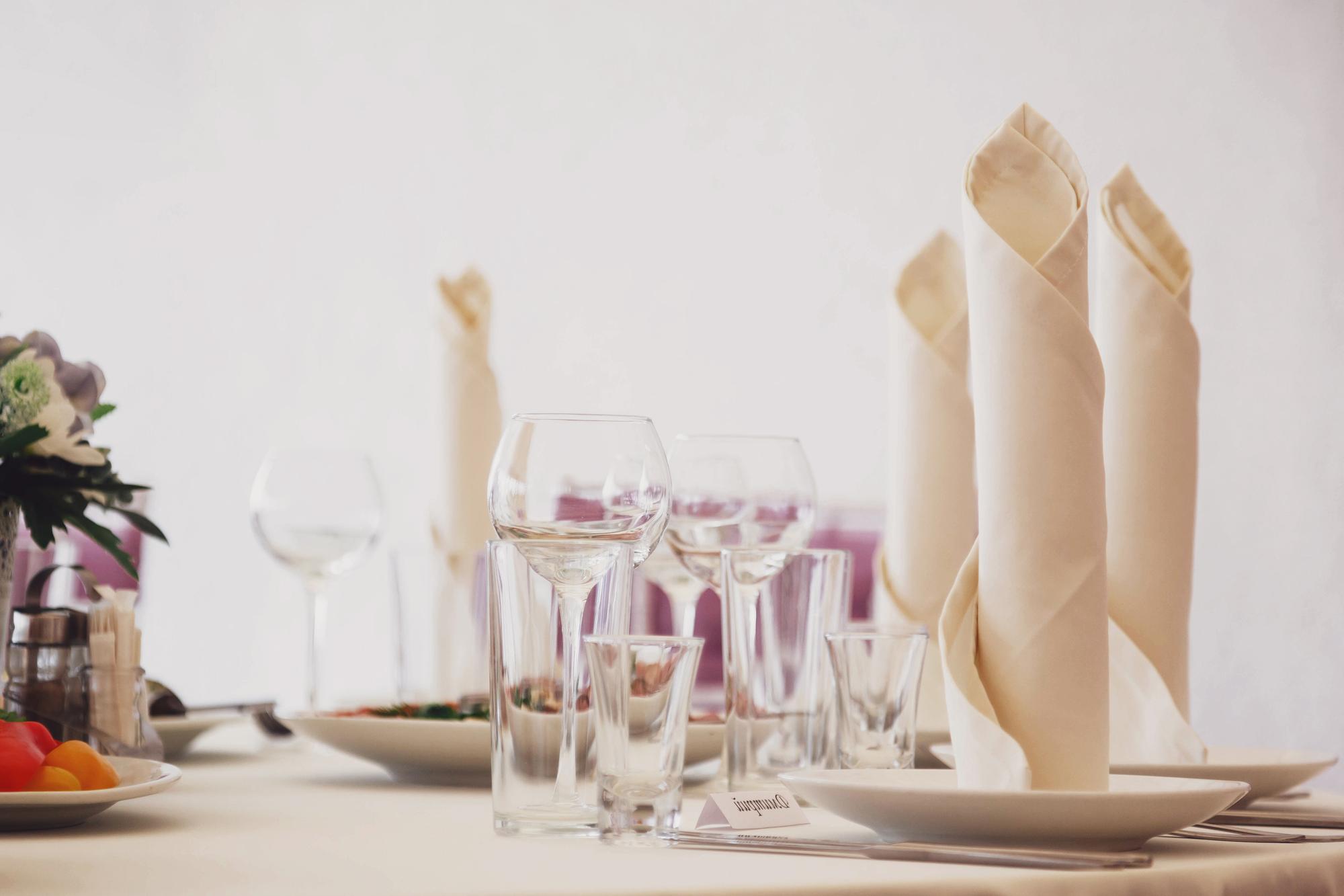 Long table set for a tasting menu with candles