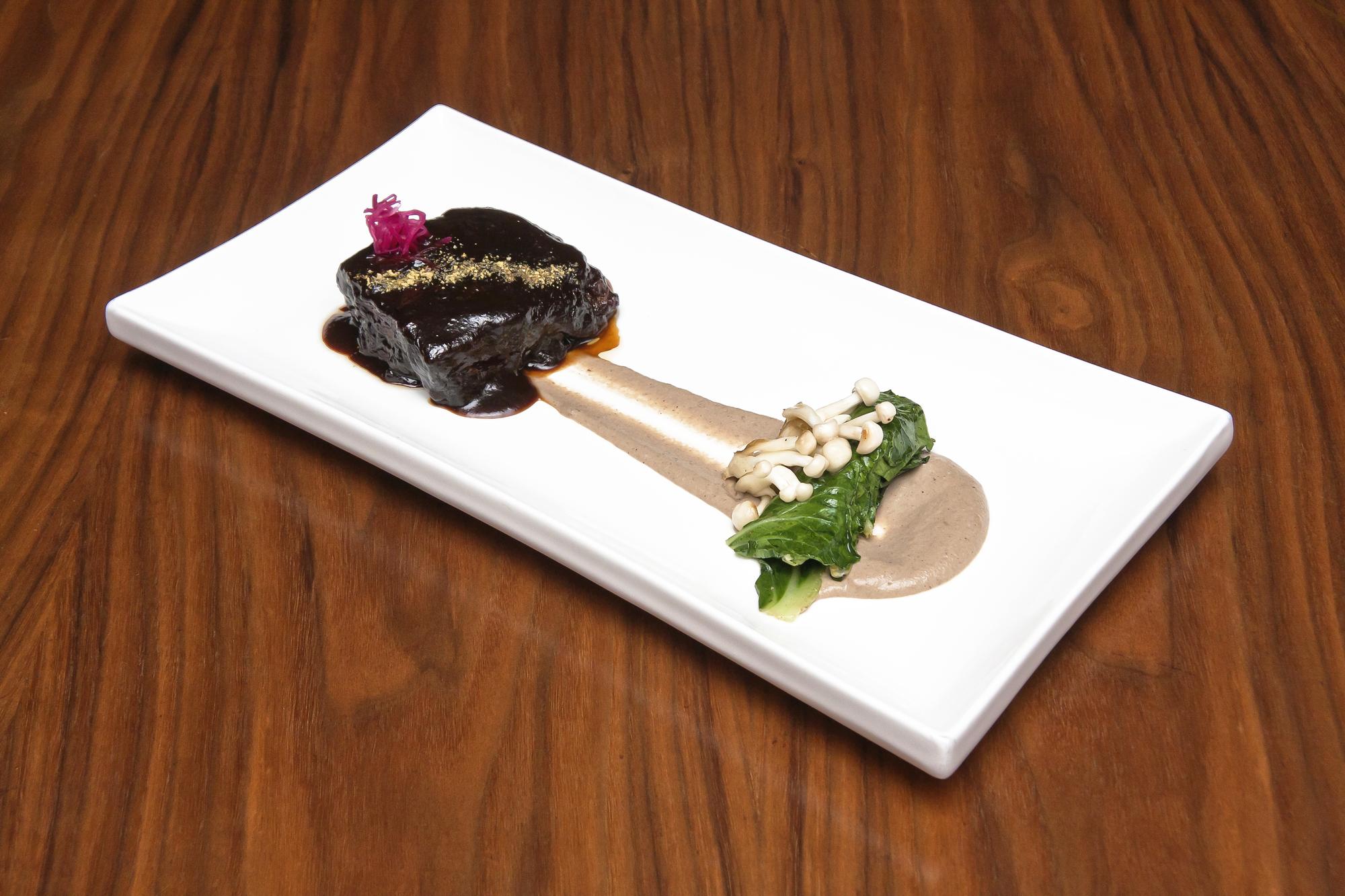 Well staged plated course with menu card
